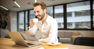 man laptop coffee banner