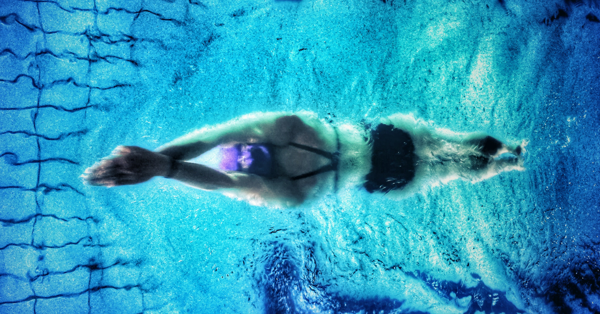 you cannot learn how to swim without getting into the pool. the same with programming. you cannot learn how to program with coding. photo light blue.